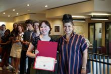 Student holding Award